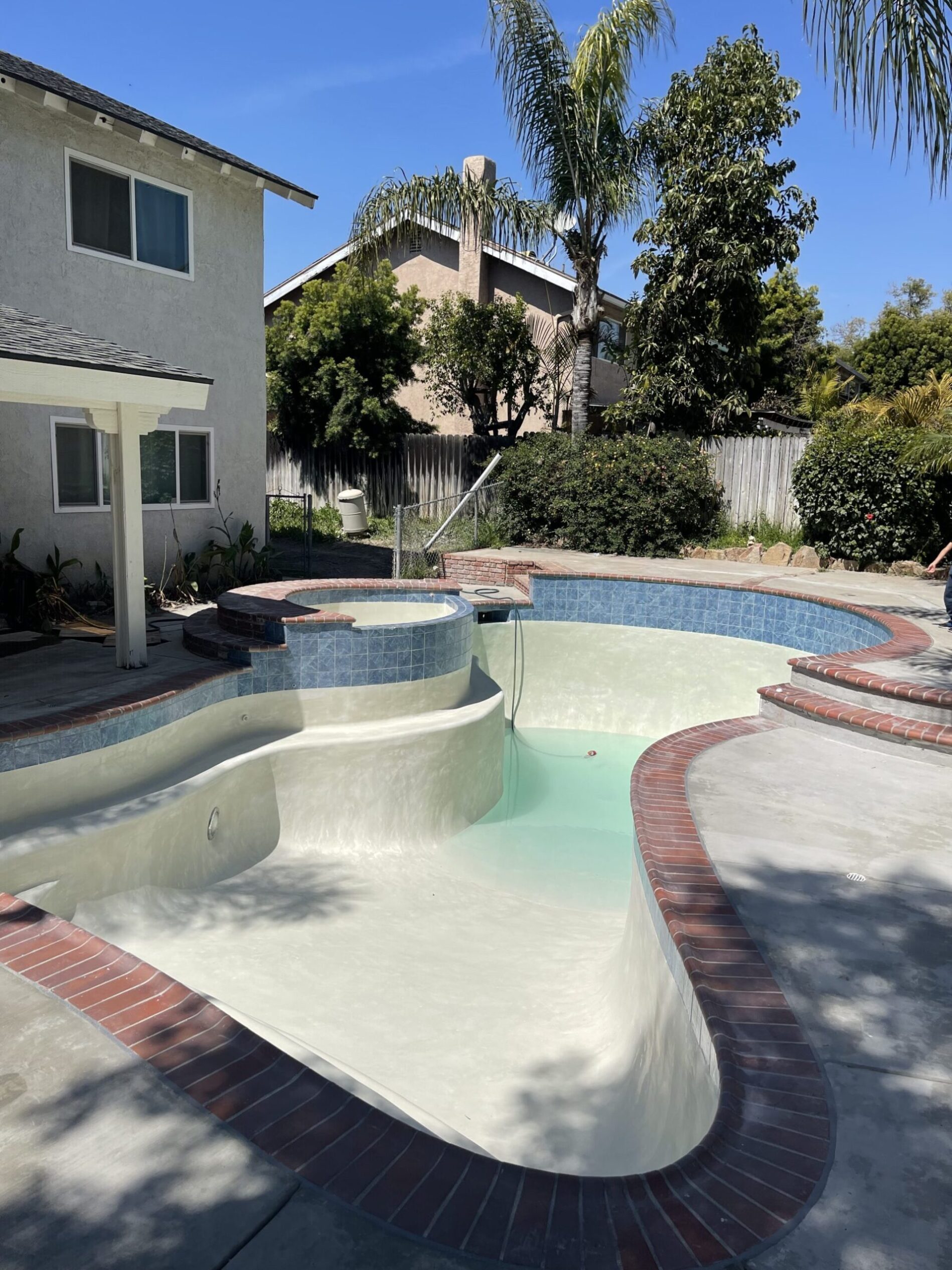 Brand new pool being filled with water